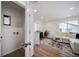 Hallway with an attached laundry room featuring a washer and dryer at 46558 Avery Ln, Bennett, CO 80102