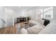 Comfortable living space with a plush white sectional sofa and stylish accents at 46558 Avery Ln, Bennett, CO 80102