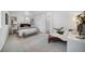 Tranquil primary bedroom featuring soft carpet and natural light at 46558 Avery Ln, Bennett, CO 80102