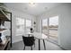 Bright and airy office featuring large window, neutral paint, modern desk, and carpet flooring at 46558 Avery Ln, Bennett, CO 80102