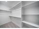 Spacious walk-in closet with ample shelving and storage solutions at 46558 Avery Ln, Bennett, CO 80102