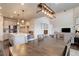 Open-concept dining area with views of the kitchen, staircase, and cozy living area at 635 Silver Rock Trl, Castle Rock, CO 80104