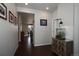 Inviting entryway featuring dark wood floors and a cabinet with glass doors at 635 Silver Rock Trl, Castle Rock, CO 80104