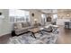 Comfortable living room with lots of natural light, stylish furniture, and an open floor plan at 635 Silver Rock Trl, Castle Rock, CO 80104