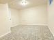 Finished basement featuring neutral walls, carpet, lighting, and new doors at 245 Miller Ave, Brighton, CO 80601