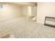 Finished basement featuring neutral walls, carpet and access to other rooms at 245 Miller Ave, Brighton, CO 80601
