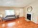 Cozy living room with a fireplace and hardwood floors at 245 Miller Ave, Brighton, CO 80601
