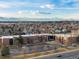 Aerial view showcasing building and mountain backdrop at 12565 Sheridan Blvd # 208, Broomfield, CO 80020