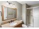 Bathroom with granite vanity, shower, and updated fixtures at 12565 Sheridan Blvd # 208, Broomfield, CO 80020