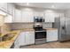 Modern kitchen with granite countertops and stainless steel appliances at 12565 Sheridan Blvd # 208, Broomfield, CO 80020