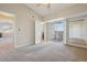Spacious bedroom featuring neutral tones, plush carpeting, and a private balcony access at 5726 N Genoa Way # 301, Aurora, CO 80019