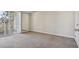 Inviting bedroom features neutral paint, carpeting and a private balcony access at 5726 N Genoa Way # 301, Aurora, CO 80019