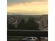 Gorgeous home featuring scenic views of the city skyline and distant mountains at dusk at 5726 N Genoa Way # 301, Aurora, CO 80019