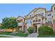 Attractive condo building featuring private balconies and well-maintained landscaping at 5726 N Genoa Way # 301, Aurora, CO 80019