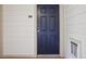 Close-up of a secure black front door with digital lock and unit number 301 at 5726 N Genoa Way # 301, Aurora, CO 80019