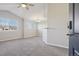 Spacious living room with vaulted ceilings, ample natural light, and neutral carpeting at 5726 N Genoa Way # 301, Aurora, CO 80019
