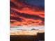 Scenic sunset view featuring vibrant, colorful clouds and a glimpse of the horizon at 5726 N Genoa Way # 301, Aurora, CO 80019