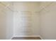 Walk-in closet features a custom organization system with multiple shelves at 5726 N Genoa Way # 301, Aurora, CO 80019