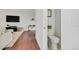 Powder room near the living room boasts a toilet, white walls, and simple decor for a modern and functional design at 6414 Stuart St, Arvada, CO 80003