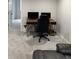 Inviting office area includes a sleek desk with dual monitors, ergonomic chair, and neutral gray carpeting at 6414 Stuart St, Arvada, CO 80003