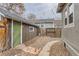 Cozy backyard featuring a charming stone pathway, lush gravel groundcover, and string lights at 109 W Simpson St, Lafayette, CO 80026