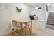 Cozy basement featuring dining table, built-in bench seating, and modern decor at 109 W Simpson St, Lafayette, CO 80026