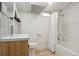 Cozy bathroom with shower/tub combination, wood vanity and modern fixtures at 109 W Simpson St, Lafayette, CO 80026