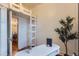 Modern bedroom features a lofted bed, hardwood floors, and a minimalist aesthetic at 109 W Simpson St, Lafayette, CO 80026
