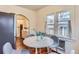 Bright and airy breakfast nook features a round table with view to adjacent kitchen at 109 W Simpson St, Lafayette, CO 80026