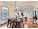 Open-concept dining room with hardwood floors, modern lighting, and ample space at 109 W Simpson St, Lafayette, CO 80026