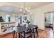 Open-concept dining area seamlessly connects to the living room with hardwood floors at 109 W Simpson St, Lafayette, CO 80026