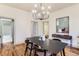 Inviting dining room featuring hardwood floors, modern chandelier, and stylish decor at 109 W Simpson St, Lafayette, CO 80026