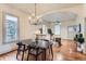 Bright dining room with modern black table set, stylish decor, and hardwood floors at 109 W Simpson St, Lafayette, CO 80026