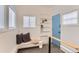 Bright entryway with a cozy window seat, built-in shelves, and a modern blue door at 109 W Simpson St, Lafayette, CO 80026