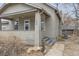 Close-up of the home's exterior showing the front porch, siding, and architectural details at 109 W Simpson St, Lafayette, CO 80026