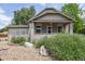 Charming single-story home with a covered porch and rock garden in the front yard at 109 W Simpson St, Lafayette, CO 80026