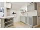 Charming kitchen featuring light wood floors, gray cabinets and white subway tile backsplash at 109 W Simpson St, Lafayette, CO 80026