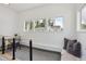 Bright living room with a built-in seating area, natural light and work space at 109 W Simpson St, Lafayette, CO 80026