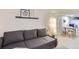 Comfortable basement living room with sleek flooring, shelving and bright light fixture at 109 W Simpson St, Lafayette, CO 80026