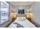 Serene main bedroom with a comfortable bed, stylish lighting, and a view to the street at 109 W Simpson St, Lafayette, CO 80026