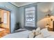 Serene bedroom featuring a large window, stylish decor, and comfortable ambiance at 109 W Simpson St, Lafayette, CO 80026