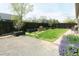 View of a backyard featuring black fencing, flower boxes and a gravel yard at 9768 Otis Dr, Broomfield, CO 80021