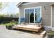 Backyard deck area featuring a sliding glass door, outdoor lighting and outdoor seating at 9768 Otis Dr, Broomfield, CO 80021