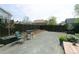 Spacious backyard with gravel ground cover, wooden planter boxes and mature trees at 9768 Otis Dr, Broomfield, CO 80021