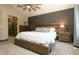 Vaulted primary bedroom featuring carpeted floor, custom window treatments, and a closet at 9768 Otis Dr, Broomfield, CO 80021