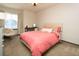 Comfortable bedroom featuring a cozy papasan chair and a large window providing lots of sunlight at 9768 Otis Dr, Broomfield, CO 80021