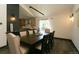 Light and bright dining room boasting modern light fixture and hardwood floors at 9768 Otis Dr, Broomfield, CO 80021