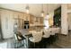 Modern kitchen with bar seating, stainless steel appliances, and ample cabinet space at 9768 Otis Dr, Broomfield, CO 80021