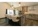 Modern kitchen with stainless steel appliances, large island with seating, and custom cabinetry at 9768 Otis Dr, Broomfield, CO 80021