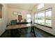 Bright office space with large windows, wood floors, modern desk and lots of natural light at 9768 Otis Dr, Broomfield, CO 80021